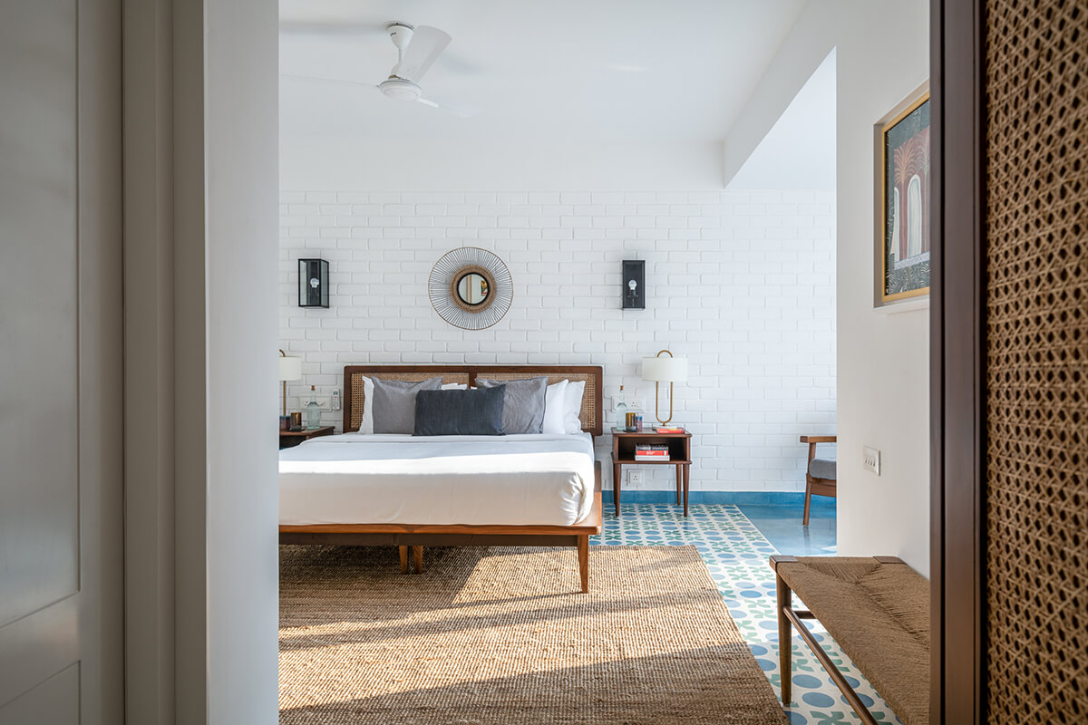 Blue Terrazzo tiled bedroom at Vianaar Homes Goa 