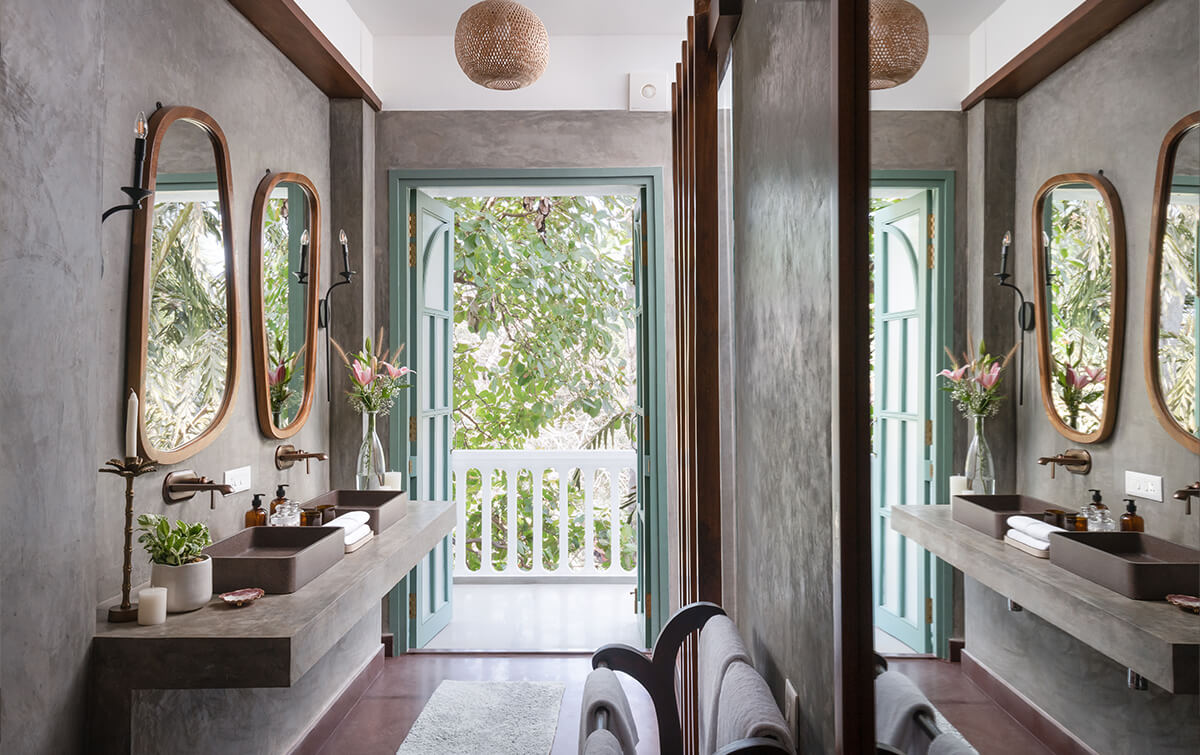 Bathroom with couple's mirror at a villa in Assagao